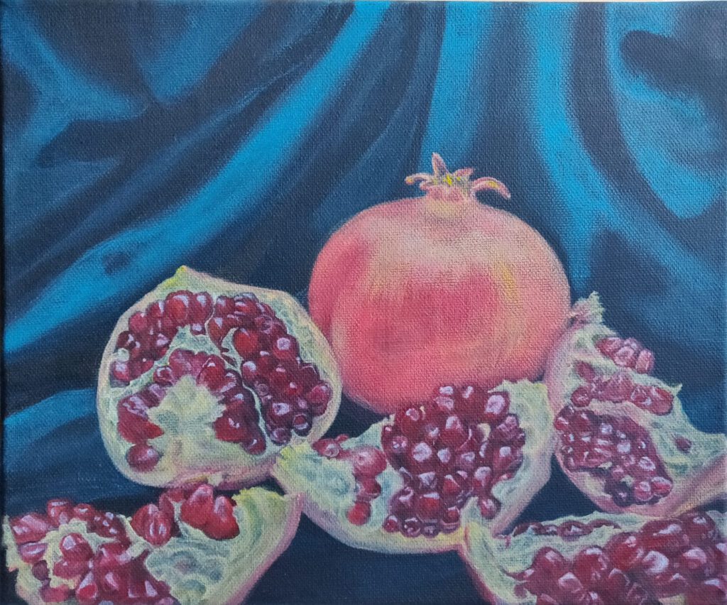 Granatapfel-Pomgranade-Granat-Fruchtbarkeit Stillleben-rot-orange-blau